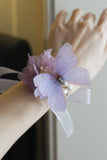 Elegante paarse vlinder prom pols corsage voor bruiloft