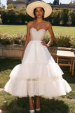 Witte strapless gelaagde A-lijn trouwjurk met kralen
