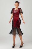 Zwarte gouden pailletten Bodycon jaren 1920 Flapper jurk met kwastjes