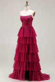 Fuchsia strapless A Line geappliqueerde korset met gelaagde ruches lange galajurk met split