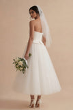 Witte A-lijn strapless lange boho trouwjurk