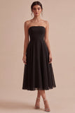 Strapless A-lijn midi black tie jurk