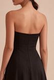 Strapless A-lijn midi black tie jurk