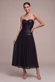 Glinsterende, strapless A-lijn midi black tie jurk met pailletten