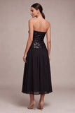 Glinsterende, strapless A-lijn midi black tie jurk met pailletten