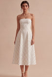 Witte en zwarte strapless A-lijn midi polka dots jurk