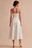 Witte en zwarte strapless A-lijn midi polka dots jurk