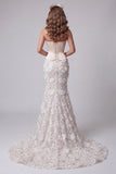 Ivoorkleurige strapless zeemeermin korset, pailletten, lange jurk met kant op de rug