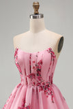 Roze A-lijn strapless korset met ruches en bloemenprint korte homecomingjurk