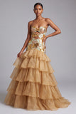 Gouden uitgesneden strapless gelaagde organza pailletten lange galajurk