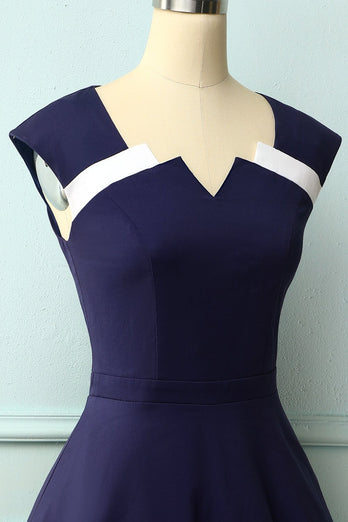 Marineblauwe jaren 50 jurk met asymmetrische hals